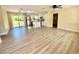 Spacious open-concept living area flows into the kitchen, featuring stylish floors at 249 Citra St, De Leon Springs, FL 32130