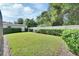 The backyard has a well-kept lawn and privacy fence at 257 Deleon Rd, Debary, FL 32713