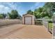 Large deck in backyard with white railings and a detached shed at 257 Deleon Rd, Debary, FL 32713