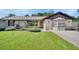 Inviting home featuring a well-maintained lawn and nicely landscaped front yard at 257 Deleon Rd, Debary, FL 32713