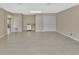 Spacious living area with neutral walls, tile flooring, and adjacent utility closet at 257 Deleon Rd, Debary, FL 32713