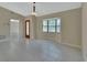 Spacious living area featuring tile flooring, neutral tones, and a bay window at 257 Deleon Rd, Debary, FL 32713