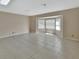 Sun-filled living room with neutral paint, tile floors, and a bay window at 257 Deleon Rd, Debary, FL 32713