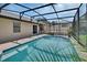 Screened-in pool with a patio and lush tropical landscaping at 257 Deleon Rd, Debary, FL 32713