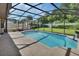 Screened in pool with a concrete patio, lawn, and view of the deck at 257 Deleon Rd, Debary, FL 32713