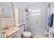 Well-lit bathroom boasts a glass enclosed shower, updated vanity, and modern fixtures at 2573 W Coral Way, Daytona Beach, FL 32118