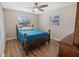 This bedroom is light and bright with wood floors, ceiling fan, and good natural light at 2573 W Coral Way, Daytona Beach, FL 32118