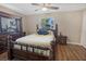 Comfortable bedroom features wood floors, ceiling fan and good natural light at 2573 W Coral Way, Daytona Beach, FL 32118