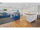 Open-concept living area with hardwood floors and comfortable furniture at 2573 W Coral Way, Daytona Beach, FL 32118