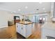 Spacious open-concept living area with hardwood floors and stainless steel appliances at 2573 W Coral Way, Daytona Beach, FL 32118