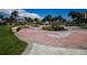 Beautifully landscaped park near 2573 Coral Way with a decorative brick patio and lush greenery at 2573 W Coral Way, Daytona Beach, FL 32118