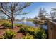 Picturesque pond with a fountain surrounded by lush greenery and mature trees on a sunny day at 2573 W Coral Way, Daytona Beach, FL 32118