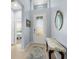 Entryway with decorative glass door and tile floors, with view into bedroom at 262 Coral Reef Way, Daytona Beach, FL 32124