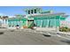 Charming building exterior with decorative shutters, vibrant colors, and welcoming entrance at 262 Coral Reef Way, Daytona Beach, FL 32124