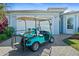 Inviting home exterior with a golf cart parked outside the garage on a sunny day at 262 Coral Reef Way, Daytona Beach, FL 32124
