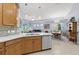 Open kitchen with stainless steel appliances, an eat-in area, and view of the living room at 262 Coral Reef Way, Daytona Beach, FL 32124