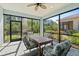 Relaxing screened lanai with a dining table and chairs, perfect for outdoor enjoyment at 262 Coral Reef Way, Daytona Beach, FL 32124