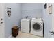 Laundry room featuring a side-by-side washer and dryer and wire shelving at 262 Coral Reef Way, Daytona Beach, FL 32124