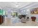 Inviting living room featuring a blue area rug, comfortable seating, and plenty of natural light at 262 Coral Reef Way, Daytona Beach, FL 32124