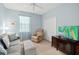 Living room featuring a light grey sofa, recliner, and large TV at 262 Coral Reef Way, Daytona Beach, FL 32124