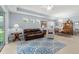 Open living space with a comfortable seating area, dining table, and large windows for natural light at 262 Coral Reef Way, Daytona Beach, FL 32124