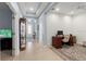 Office space with beige tile, wood desk, and view of front door and hallway at 262 Coral Reef Way, Daytona Beach, FL 32124
