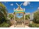 Decorative entrance to 'Paradise Pool' framed by bamboo structures and tropical foliage at 262 Coral Reef Way, Daytona Beach, FL 32124