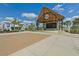 Town center pavilion with stage and a large screen, designed for community entertainment and events at 262 Coral Reef Way, Daytona Beach, FL 32124
