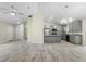 Modern kitchen featuring stainless steel appliances, gray cabinetry, an island, and gorgeous tile floors at 266 Buford Ave, Orange City, FL 32763