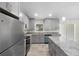 Beautiful kitchen boasts granite counters, stainless appliances, shaker cabinets, and a center island at 266 Buford Ave, Orange City, FL 32763