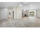 Spacious living room featuring modern lighting, and gorgeous tile floors with open concept at 266 Buford Ave, Orange City, FL 32763
