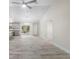 Spacious open-concept with kitchen and living room featuring modern lighting, and gorgeous tile floors at 266 Buford Ave, Orange City, FL 32763