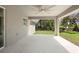 Large outdoor patio with ceiling fan overlooking the backyard at 266 Buford Ave, Orange City, FL 32763