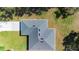 Aerial view showcases the roof and the well-maintained surrounding landscape at 266 Buford Ave, Orange City, FL 32763