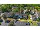 Aerial view of townhomes with mature landscaping and a parking lot at 2704 Lancaster Ct, Apopka, FL 32703