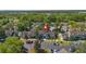 Community aerial view highlighting landscaping, parking, and a glimpse of a nearby lake at 2704 Lancaster Ct, Apopka, FL 32703
