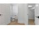Clean bathroom with toilet and doorway leading to hallway and closet at 2704 Lancaster Ct, Apopka, FL 32703