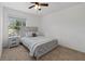 Bedroom featuring carpet, neutral paint, a window and view, and a modern farmhouse headboard at 2704 Lancaster Ct, Apopka, FL 32703