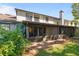 Rear exterior view of the home highlighting the screened-in patio and backyard space at 2704 Lancaster Ct, Apopka, FL 32703
