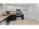 Spacious kitchen featuring stainless appliances, granite countertops, and white cabinets at 2704 Lancaster Ct, Apopka, FL 32703