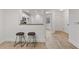 Cozy kitchen with a breakfast bar, wooden stools, and modern appliances at 2704 Lancaster Ct, Apopka, FL 32703