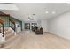 Spacious living room featuring wood-look tile floors and sliding glass doors to the outside at 2704 Lancaster Ct, Apopka, FL 32703