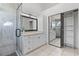 Modern bathroom featuring a glass-enclosed shower and a spacious vanity at 2704 Lancaster Ct, Apopka, FL 32703