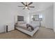 Bright main bedroom featuring a ceiling fan, neutral decor, and ample natural light at 2704 Lancaster Ct, Apopka, FL 32703