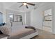 Inviting main bedroom featuring a ceiling fan and neutral decor and ensuite access at 2704 Lancaster Ct, Apopka, FL 32703