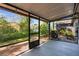 Outdoor screened patio overlooking the lush backyard, ideal for enjoying the outdoors at 2704 Lancaster Ct, Apopka, FL 32703