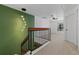 Staircase area featuring carpeted steps and an upper-level landing with a ceiling fan at 2704 Lancaster Ct, Apopka, FL 32703