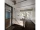 Hallway with stairs and an exit sign, providing access to a unit with wood floors at 2706 Oak Trail Run # 6, Port Orange, FL 32127