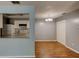 Open-concept view of the kitchen with white cabinets, appliances, and a connecting dining area at 2706 Oak Trail Run # 6, Port Orange, FL 32127