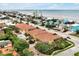 Aerial view of condos near the beach with private pools and lush landscaping, offering coastal living at its finest at 2982 S Atlantic Ave, New Smyrna Beach, FL 32169